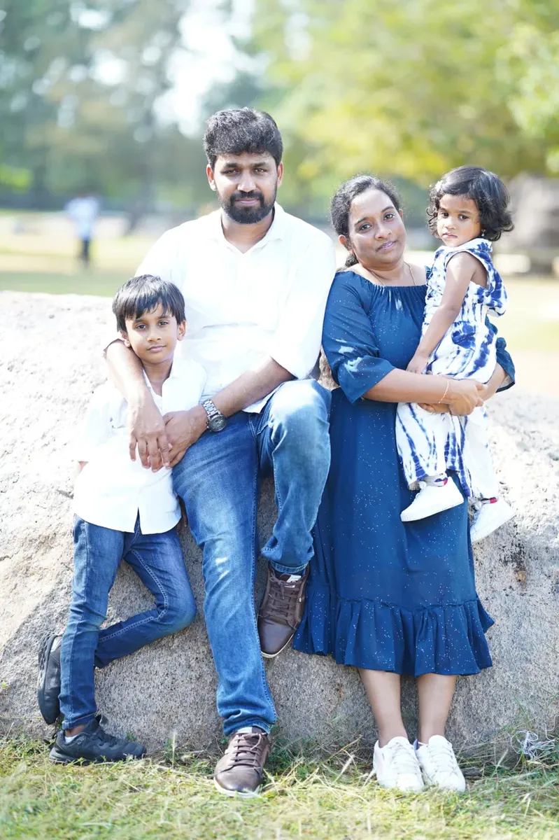 Family of four on a rock