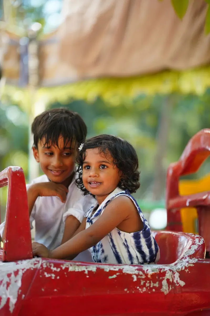 Brother and sister on a play ride